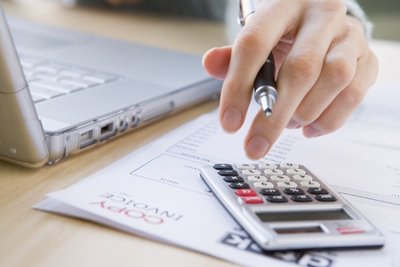 small-business-accountant-calculator-hand-min