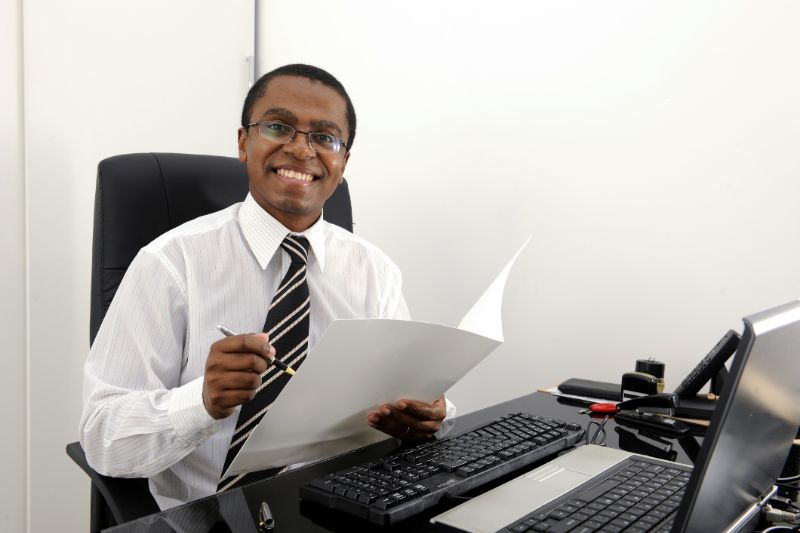 small-business-accountant-man-at-desk-min