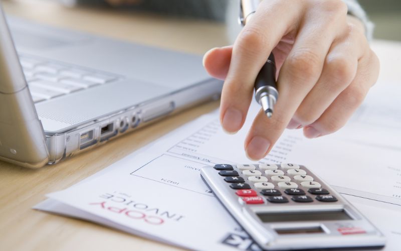 small-business-accountant-calculator-hand-min