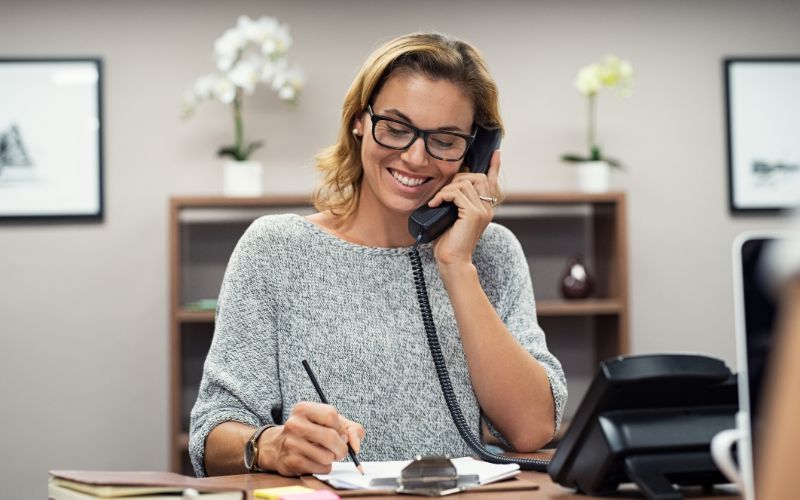 small-business-accountant-happy-lady-making-call-min