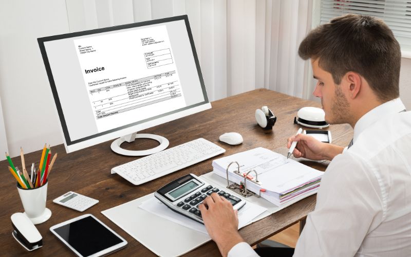 small-business-accountant-working-on-desktop-min