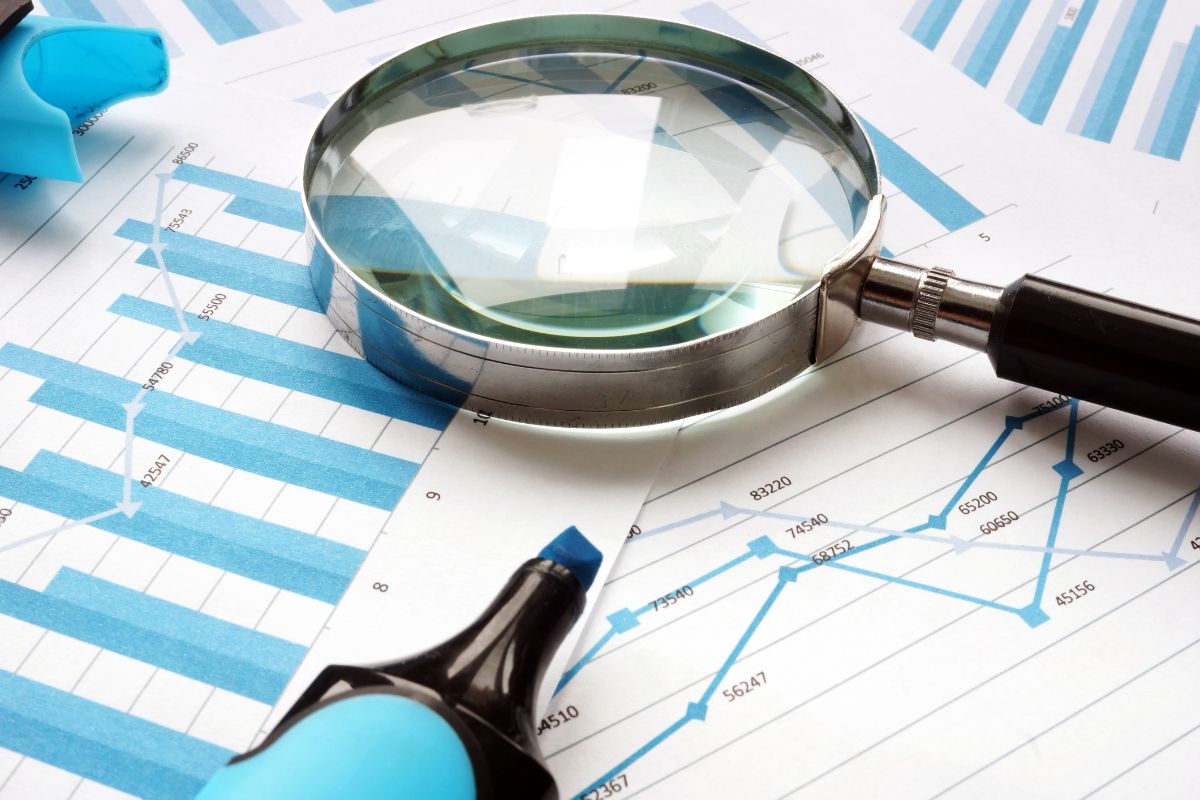 ccounting-services-for-small-business-south-africa-magnifying-glass-and-financial-documents-audit-and-accounting-min