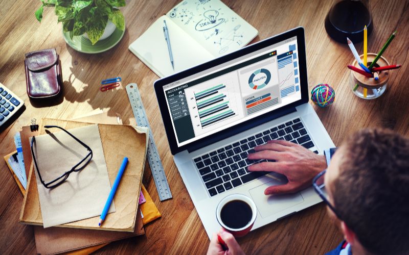 SureBooks- accounting services for small bsuiness South Africa-man-analysis-business-accounting-on-laptop-min