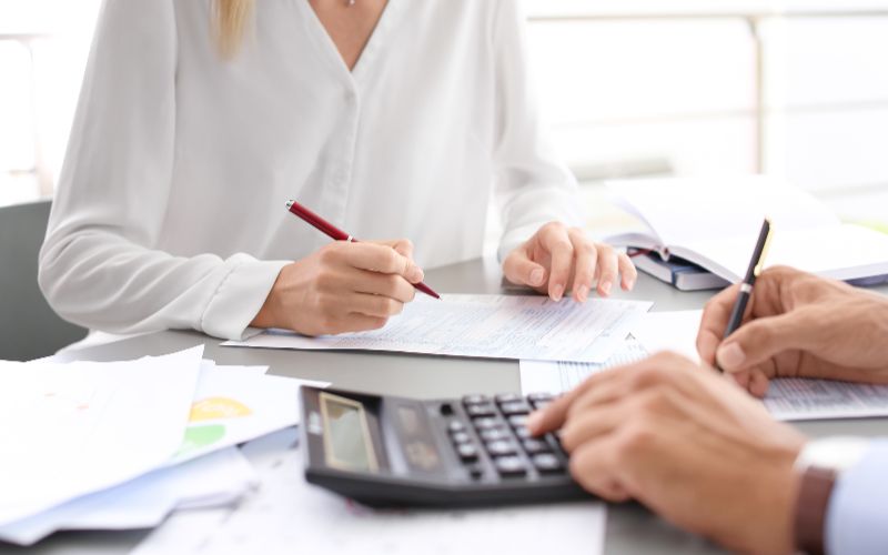 accounting-services-Cape-Town-tax-accountants-working-with-documents-min