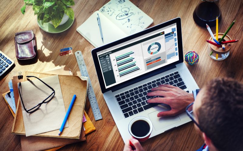 SureBooks- accounting services for small bsuiness South Africa-man-analysis-business-accounting-on-laptop-min