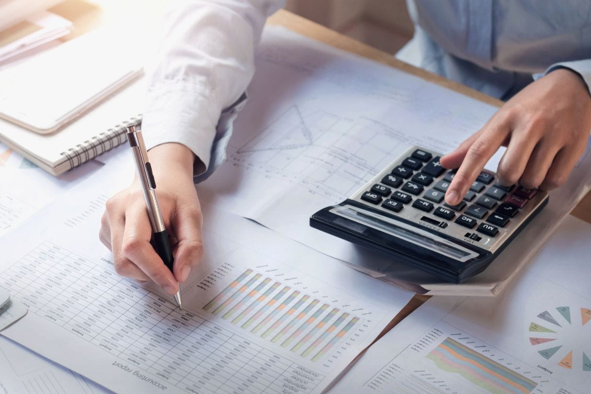 accounting-services-for-small-business-south-africa-finance-and-accounting-concept-business-woman-working-on-desk-using-calculator-to-calculate