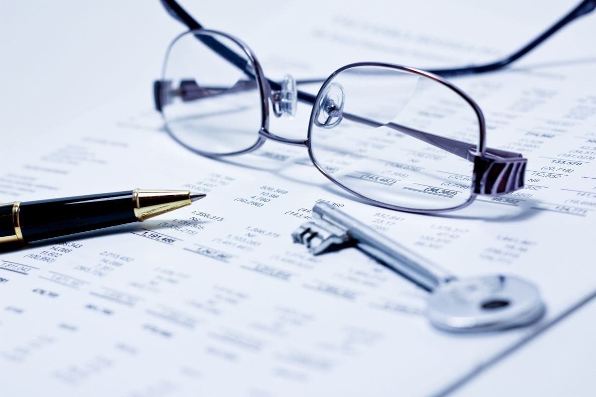 SureBooks - Accounting Serives Small Busienss South Africa - glasses - and - pen - on - paper