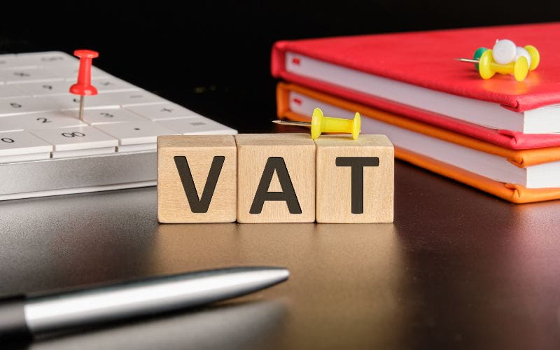 accounting-services-cape-town-vat-the-text-of-non-wooden-cubes-next-to-notepads-a-calculator-a-pen-on-a-black-background