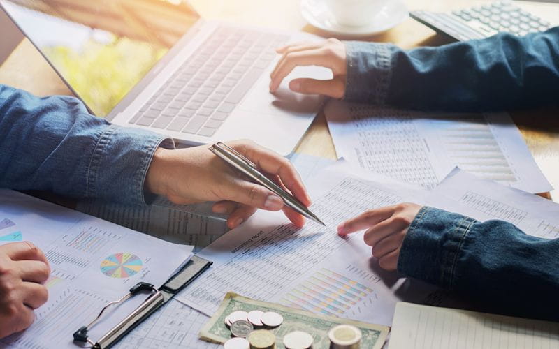 SureBooks - Accounting Services For Small Busienss South Africa - accounting on table with hands (1)